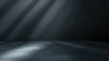 A dark, moody interior scene with soft light rays creating dramatic shadows on the floor.