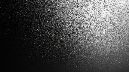 A mesmerizing close-up of water droplets cascading on a dark surface, creating a shimmering effect.