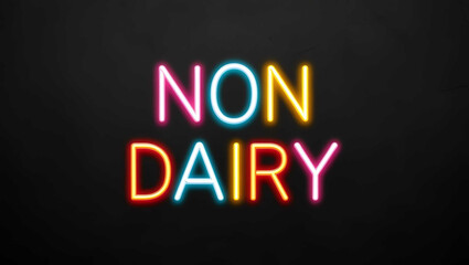 Obraz premium Non Dairy colorful neon lettering on plain black dark background