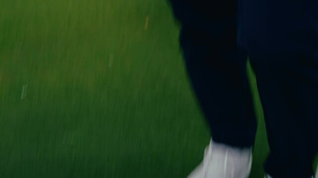 Male golfer high fives playing partner after sinking putt on putting green on Ireland links golf course