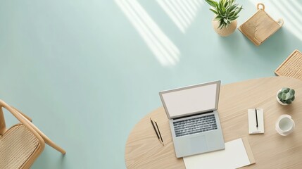 Minimalist Workspace with Laptop, Plants, and Stationery