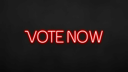 Obraz premium Vote Now red neon lettering on plain black dark background