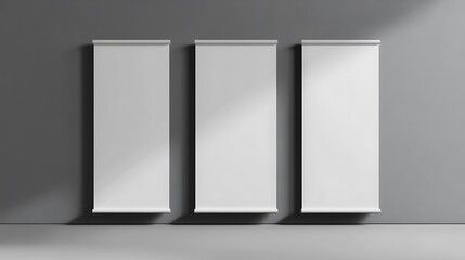 Three Blank Roll Up Banners on Gray Wall Mockup