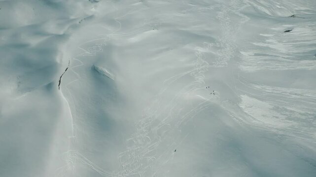 Freeride snowboarding in winter. Heliboarding freeride. Riding in powder on snowborad. Ski, Snowboard freeride i deep powder snow. Gudauri Georgia Caucasus resort. Freeride in Caucasus mountains. 