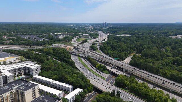 Aerial shot rotating around interstate 85 and GA 400 during a summer day in Atlanta.