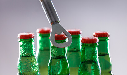 Beer bottles and metal bottle opener