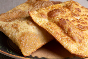 Pastry with melted cheese and fried golden dough