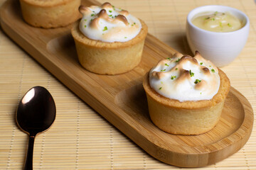 Baked tartlets with white cream, delicious dessert