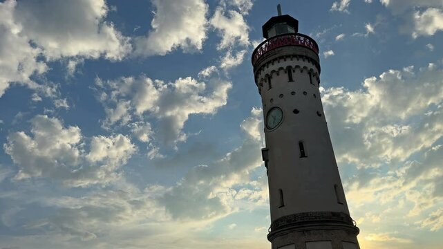Lindau Harbour with the Landmark Lighthouse from 18th century and sunset in summer time, Germany
