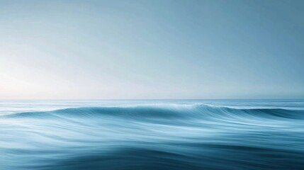 A minimalist image of ocean waves rolling softly toward the shore, with a wide-open horizon in the distance