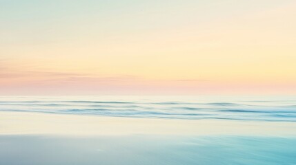 Fototapeta premium Soft, pastel colors dominate the sky as the sun rises over a serene beach scene, creating a calming and peaceful atmosphere