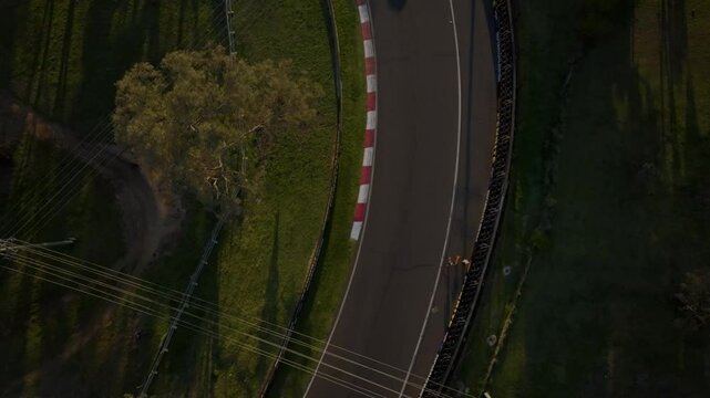 Quarry bend track section at Wahluu Mount Panorama Bathurst Race track drone aerial hero shot landscape wide