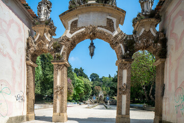 Fototapeta premium Historic Archway in Coimbra's Santa Cruz Park, Portugal