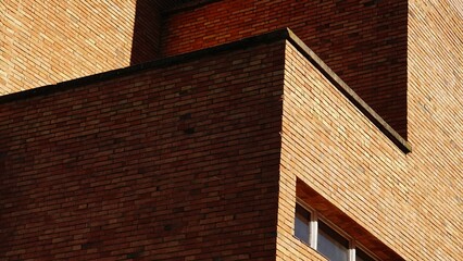 corner of an industrial building with a red brick facade