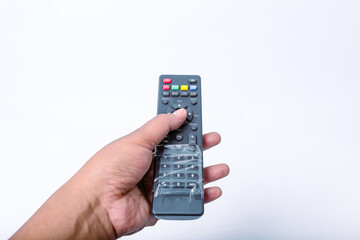 Man's hand holding remote control. TV remote control with clipping path isolated on white background.