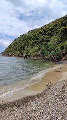 The beautiful coastal settings with turquoise blue water at the Bay of Islands, New Zealand