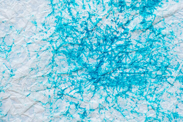 Wet, crumpled, paint-splattered paper as a background.