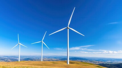 Fototapeta premium Panoramic view of wind turbines against a clear blue sky, symbolizing renewable energy and sustainable development.