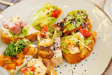 Assorted sandwiches with different fillings. A simple and delicious appetizer for a banquet. catering for a buffet table.