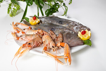 Fresh fish plate on a white table