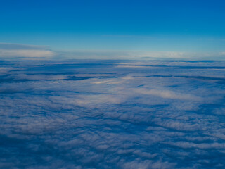 view from airplane window on cloudscape