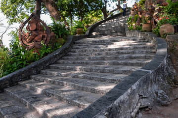Walkaway stairway in green idyllic natural environment. Stone stairs in an old park