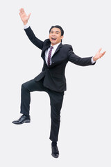 A young exuberant and excited asian businessman jumping for joy. Leaping, celebrating his success. Whole body photo, isolated on a white background.