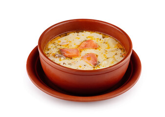 Creamy finnish salmon soup with dill and potatoes in rustic brown bowl