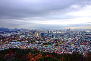 Yongsan-gu, Seoul, South Korea - November 9, 2020: Aerial and night view of downtown Seoul and Han River seen from autumnal Namsan Mountain