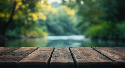 Fototapeta premium A serene riverside view with a wooden surface in the foreground.