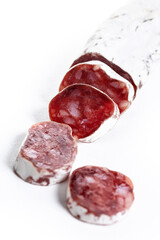 Fuet.Dry cured fuet sausage, isolated on white background.