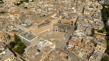 Fototapeta premium Aerial view of Sant'Oronzo square and the Roman amphitheater of Lecce, In Puglia, Italy. It is for the people of Lecce the main meeting place, entertainment and privileged location for shows.