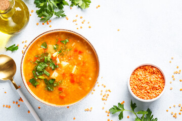 Red lentil soup, traditional middle eastern food on white background. Top view with space for design.
