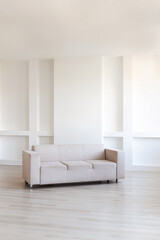 A Modern Minimalist Living Room Featuring a Stylish and Comfortable Beige Couch Design