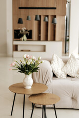 Pink and white tulips bringing freshness to modern living room