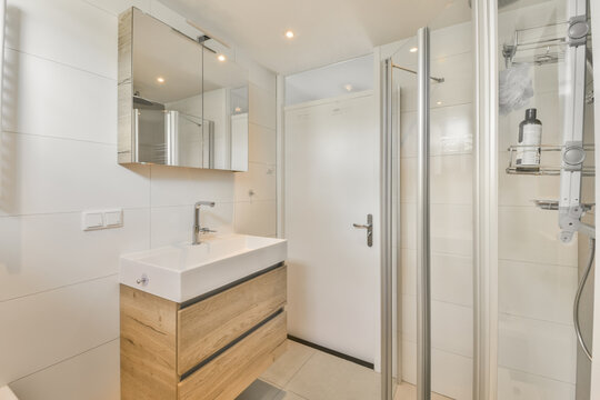 Modern and bright bathroom interior with shower