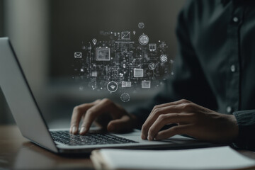 A man in a black shirt is typing on his laptop, with icons of education and business floating above the screen.