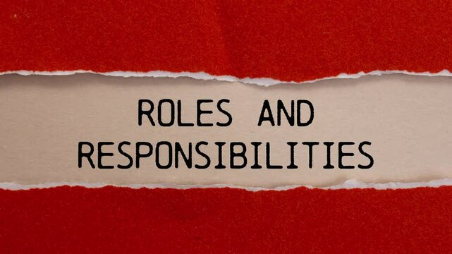 Roles and responsibilities message writing on ripped red torn paper on beige background. Conceptual roles and responsibilities symbol.