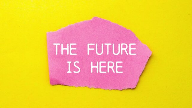 The future is here message writing on ripped pink torn paper piece on yellow background. Conceptual the future is here symbol.