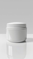 A minimalistic white cosmetic jar displayed on a reflective surface, showcasing sleek design and simplicity in a modern setting
