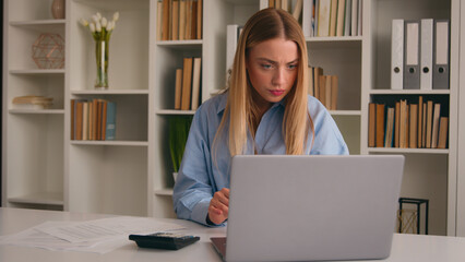 Confused frustrated Caucasian girl woman at office failure with documents stressed with papers bills stress about bank loan payments mistake businesswoman counting business taxes financial problems