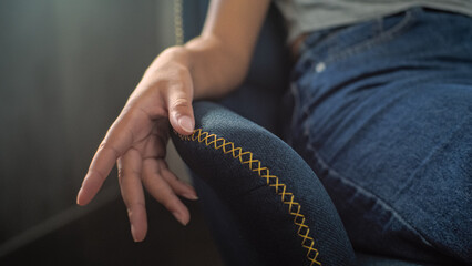 Close up of hand of African American girl sitting on chair and gesturing during consultation with...
