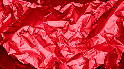 Crumpled shiny red metallic foil creating abstract texture. Generative AI