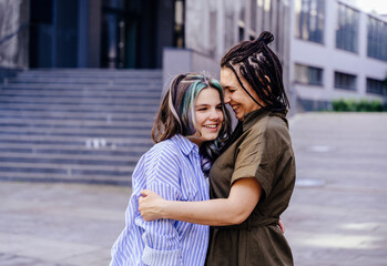 Fototapeta premium Happy, mother with and teen daughter with colorful hairstyle touching face for love, care and proud family for support.