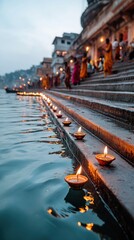 Serene scene of ghat in Varanasi, India, with lit diyas floating on the Ganges River and people in colorful clothing performing rituals.