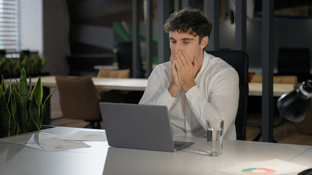 Shocked Caucasian businessman with laptop failure in office business man shock problem fail lose online trouble company crisis male professional computer stress worker bankrupt browsing pc crash error