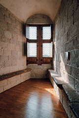 Interior view of the tower of Dinan Castle, medieval castle window under sunlight, Dinan in France