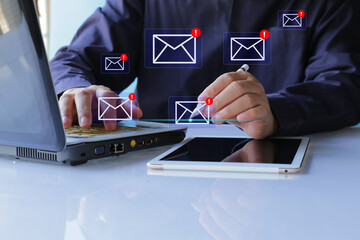 Email Spam concept. Person use computer and  tablet  with virtual screen of Spam email notification, warning notification and spam message..