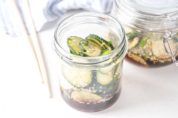 Trendy viral Asian cucumber salad, soy sauce marinated pickled cucumber salad with sesame oil and spices