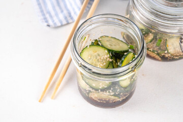 Trendy viral Asian cucumber salad, soy sauce marinated pickled cucumber salad with sesame oil and spices